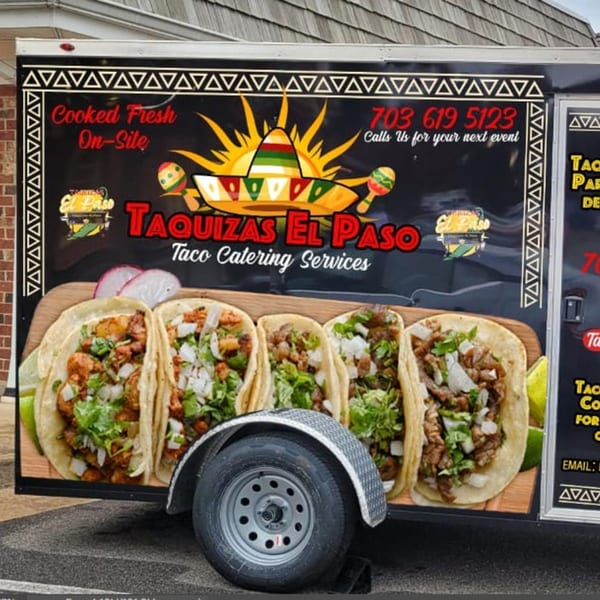 El Paso Mexican Restaurant's black taco catering truck with a large graphic of five tacos.