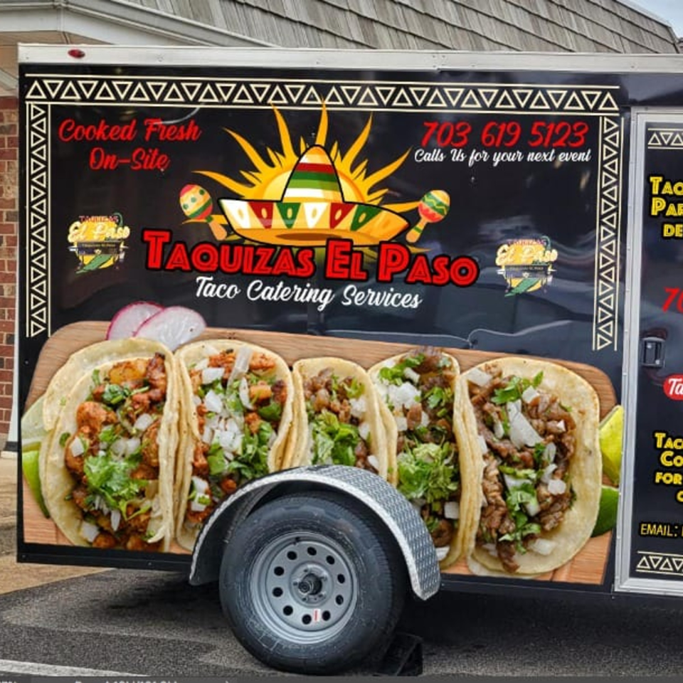 El Paso Mexican Restaurant's black taco catering truck with a large graphic of five tacos.
